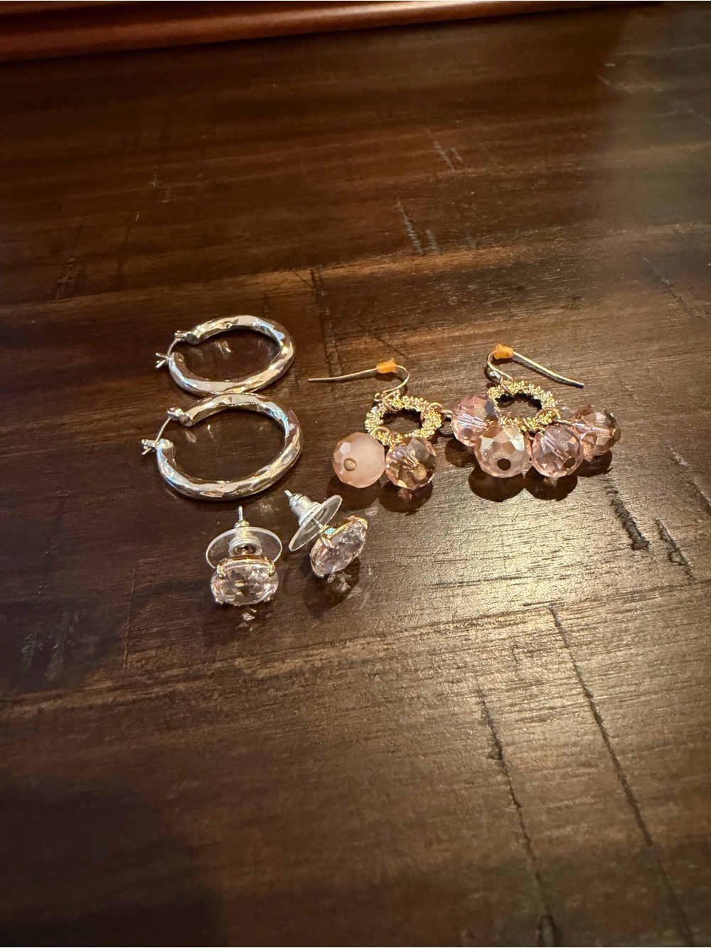 Assorted gold and pink earrings